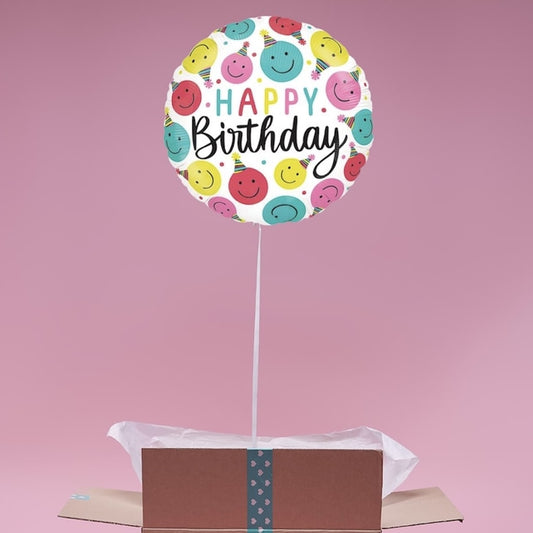 Ballon rond doré Happy Birthday emojis dans box ouverte.