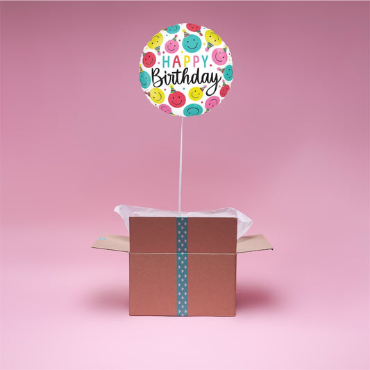 Ballon rond Happy Birthday avec emojis dans box ouverte.