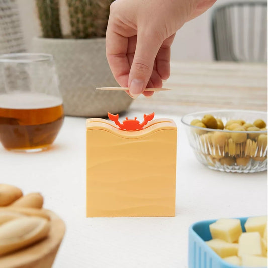 Cure-dents apparaissant magiquement dans les pinces du crabe