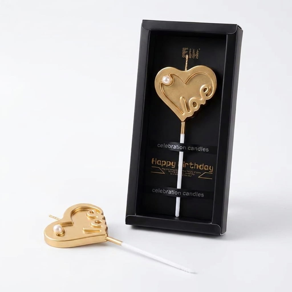 Bougie cake topper en forme de cœur doré avec inscription "love" et perle nacrée, dans coffret noir et or — décoration anniversaire chic Lune de Cœur
