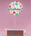Ballon rond doré Happy Birthday emojis dans box ouverte.