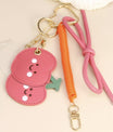 Grigri cerise kawaii rouge et rose avec deux visages souriants – bijou de sac et téléphone